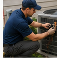 Technician performing central air conditioner repair